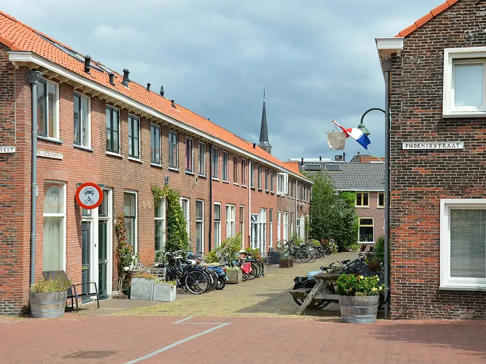 A quiet street of brick terraced houses in Delft