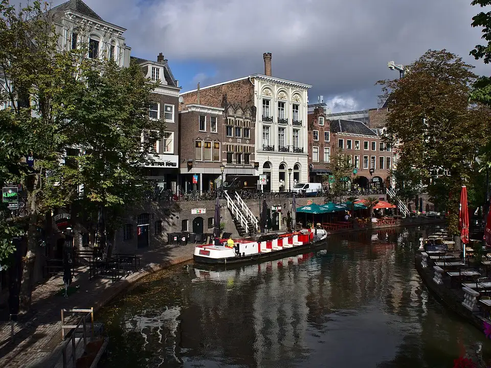 The Oudegracht in Utrecht by the Jansbrug, with a boat on the canal